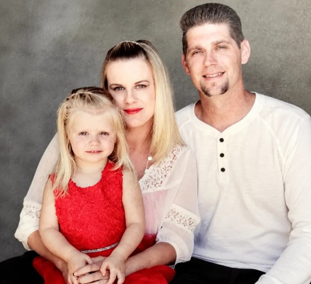 Jesse Gonzales with his wife and young daughter